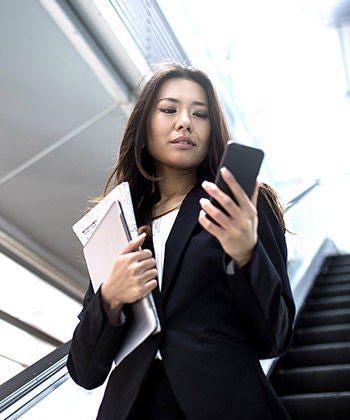 businesswoman checking her smartphone
