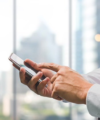 close up of hand texting on a smartphone