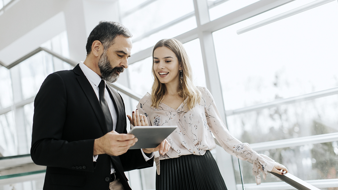 colleagues looking at a tablet
