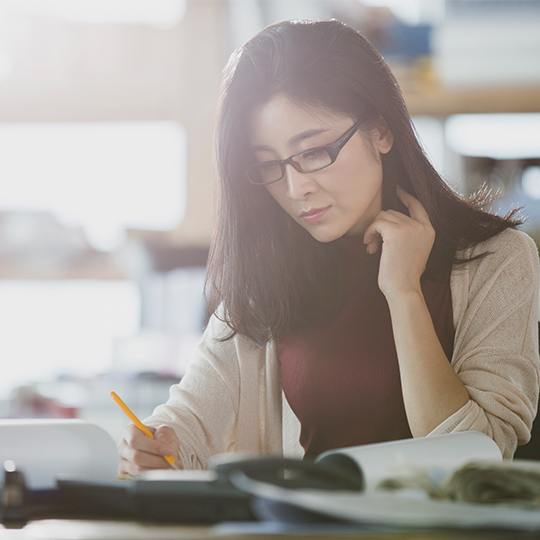 woman looking into some papers