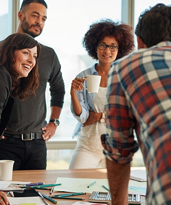 colleagues smiling in a meeting