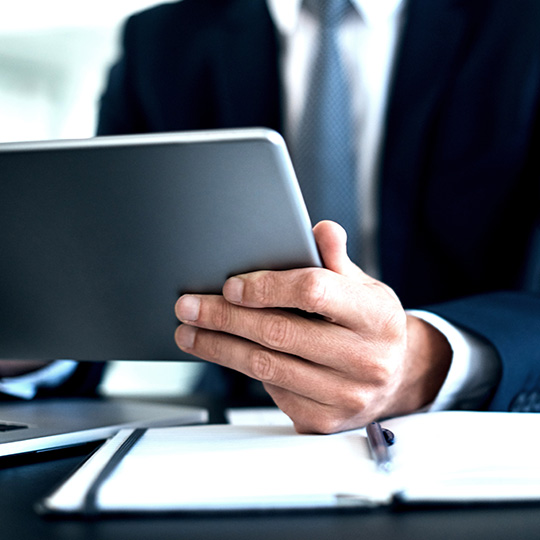 close up of businessman using a tablet