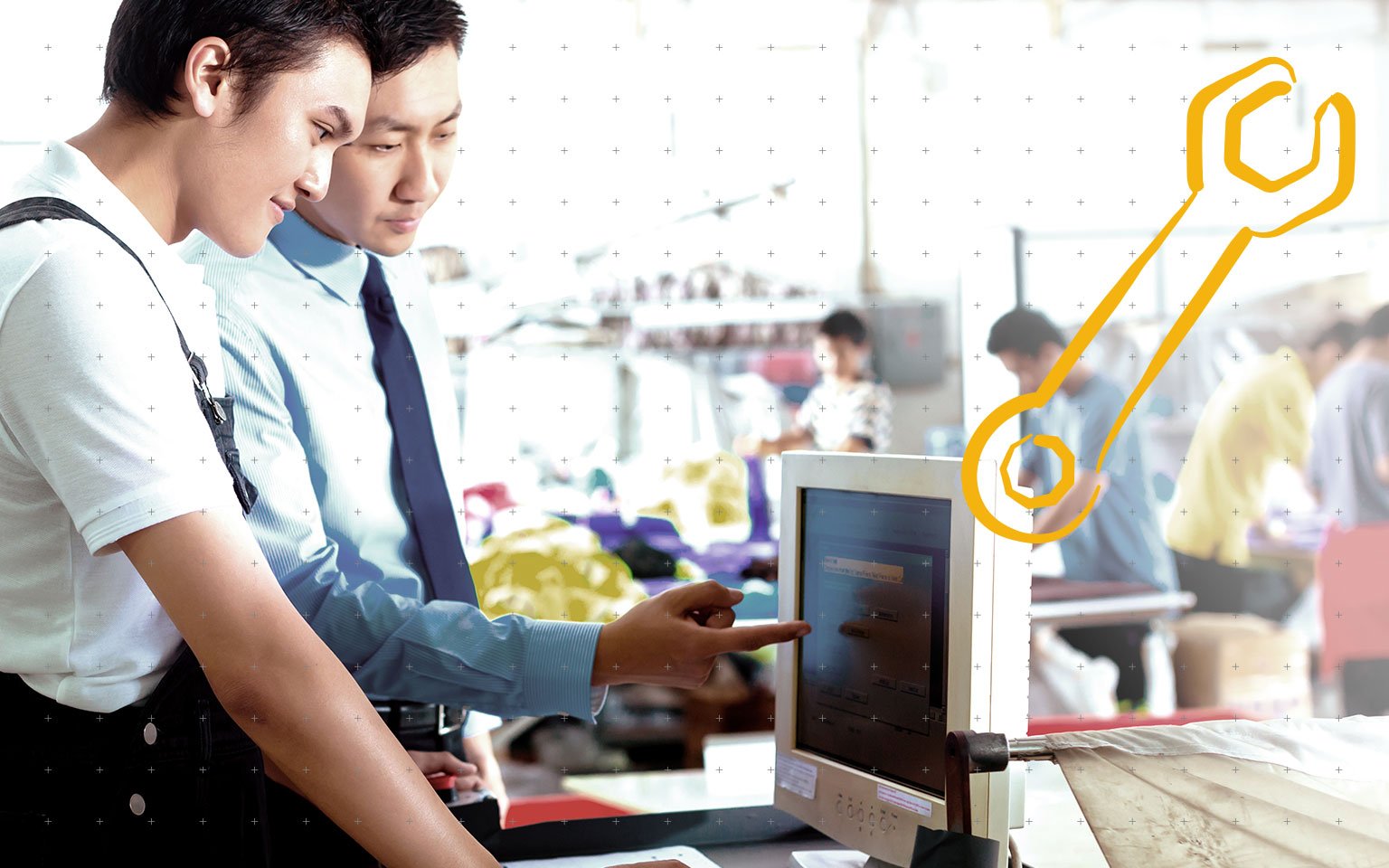 one man showing another something on a computer screen