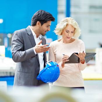 colleagues doing a factory check