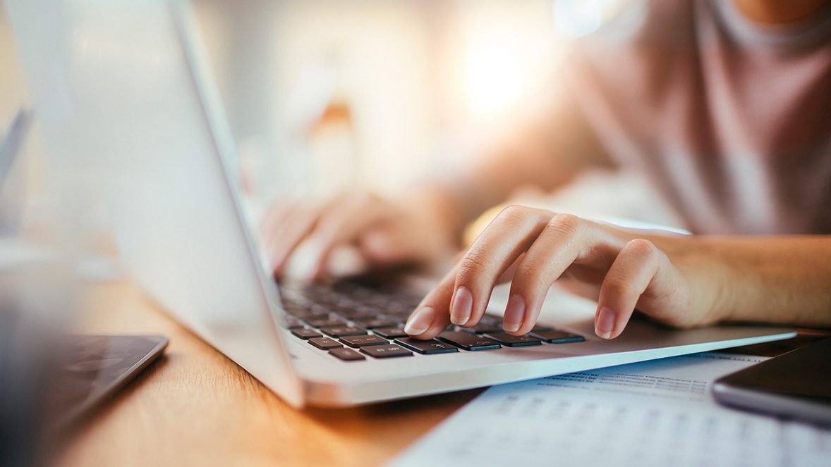 hands typing on a keyboard hands typing on a keyboard