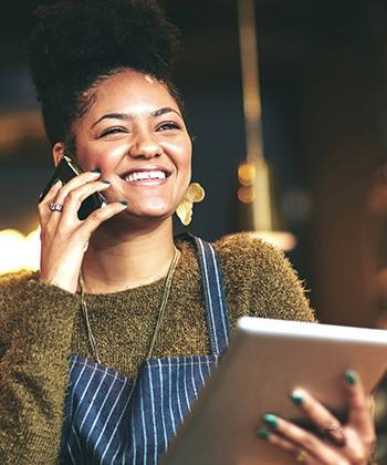 Strategischer worden  waitress using a phone and tablet