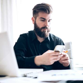 Kyocera Capture Manager man looking into her mobile